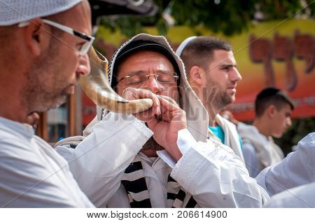 Jewish hasid blows Shofar. Uman Ukraine - 21 September 2017: Rosh Hashanah Jewish New Year.