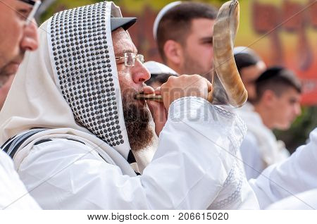 Jewish hasid blows Shofar. Uman Ukraine - 21 September 2017: Rosh Hashanah Jewish New Year.