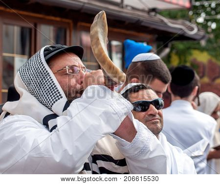 Jewish hasid blows Shofar. Uman Ukraine - 21 September 2017: Rosh Hashanah Jewish New Year.
