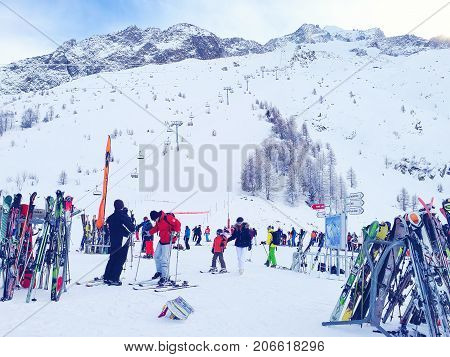Chamonix, France - January , 24, 2015: People skiing, pile of Skis and slopes view at Les Grands Montets ski area near Chamonix, France