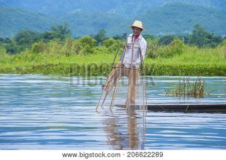 INLE LAKE MYANMAR - SEP 07 : Burmese fisherman at Inle lake Myanmar on September 07 2017 inle Lake is a freshwater lake located in Shan state