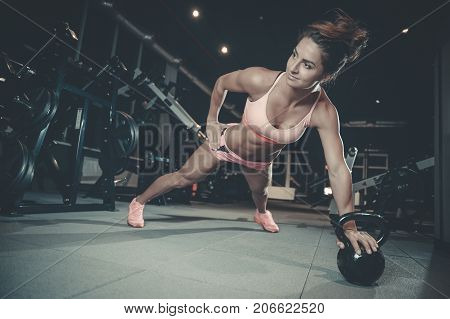 Sexy Athletic Young Girl Training Back In Gym