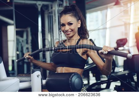 Sexy Athletic Young Girl Training Back In Gym