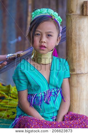 KAYAN STATE MYANMAR - SEP 09 : Portrait of Kayan tribe girl in Kayan state Myanmar on September 09 2017 Kayan tribe woman are well known for wearing neck rings.