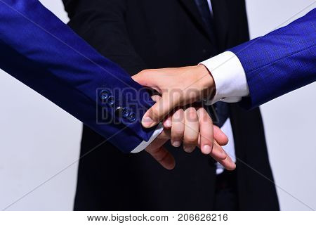 Businessmens Hands Wearing Formal Wear On Grey Background.