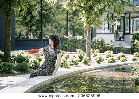 A Young Girl Walks In An Old Park.