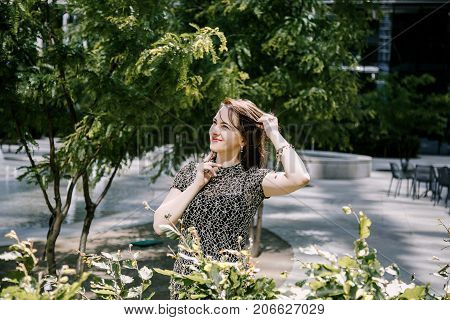 A Young Girl Walks In An Old Park.