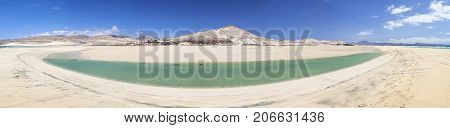 Beach and lagoon at Playas De Sotavento near Risco El Paso. The lagoon is at Playa Barca.