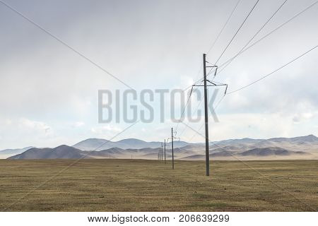 Electric power transmission pylons on inner mongolia grassland