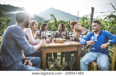 Group of friends at restaurant outdoors - People having dinner in a home garden
