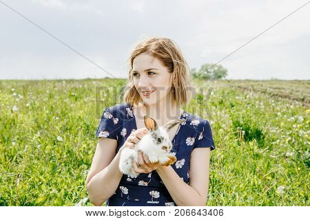 Young Girl With A Little Rabbit.