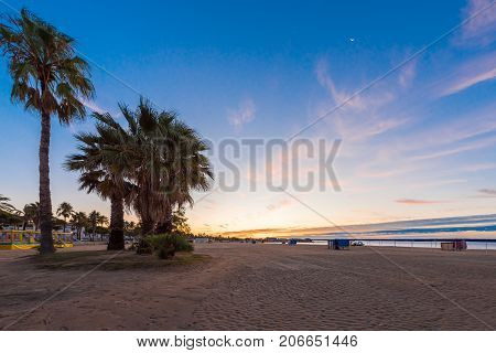 Sunset On The Beach Of Cambrils, Catalonia, Spain. Copy Space For Text.