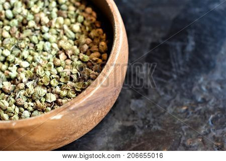 Thyme background. Thyme in a wooden bowl on a table