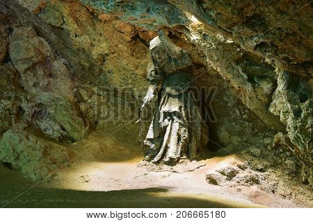 Knaresborough-England August - 2017 Statue of Mother Shipton's Cave is England's oldest visitor attraction having been open since 1630. Editorial photo