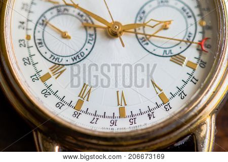 A Macro view of a gold watch.