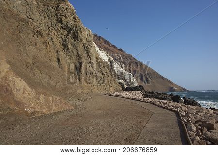 Anzota Caves at Arica on the coast of Chile. The area was used as a settlement by the Chinchorro people and later mined for guano deposited on the cliffs.
