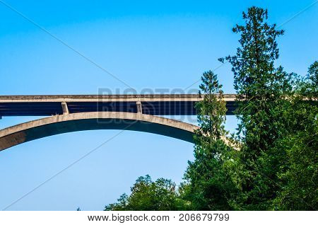Scenic unique view of highway bridge extending over river.  Image taken from underneath to create and interesting vantage point of this beautiful structure.