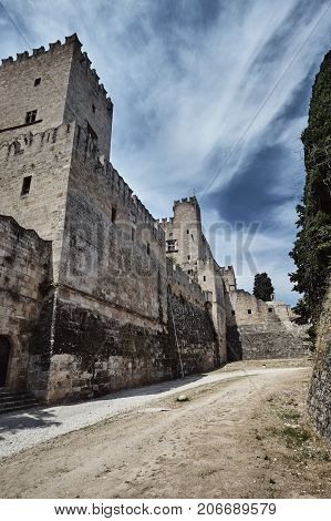 The moat and turrets of the medieval castle of the Joannite Order in the city of Rhodes