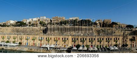 Row of restaurants in the port of  Valletta in Malta.