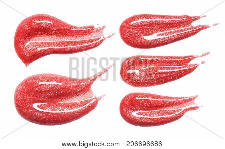 Set of different lip glosses smear isolated on white. Smudged makeup product sample