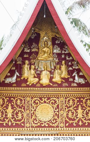 Bas-relief On The Wall Of The Temple Wat Sensoukaram In Louangphabang, Laos. Vertical. Close-up.