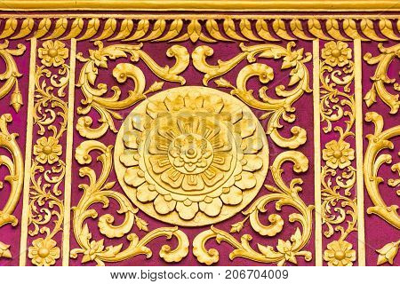 Bas-relief On The Wall Of The Temple Wat Sensoukaram In Louangphabang, Laos. Close-up.
