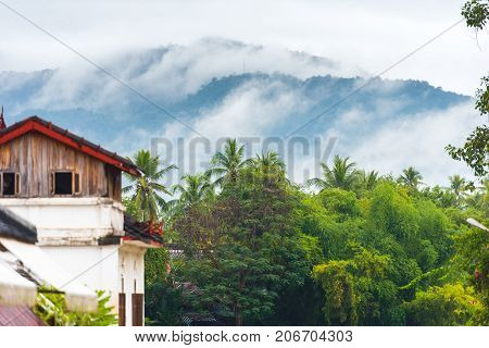View Of The Misty Landscape, Louangphabang, Laos. Close-up. Mountains In The Fog. Copy Space For Tex