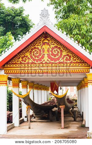 Boats In The Courtyard Of The Temple Wat Sensukaram In Louangphabang, Laos. Close-up. Vertical.