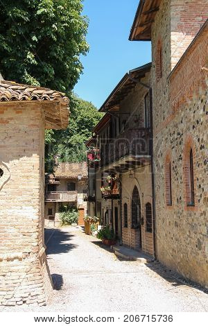 Narrow street of ancient Grazzano Visconti Italy