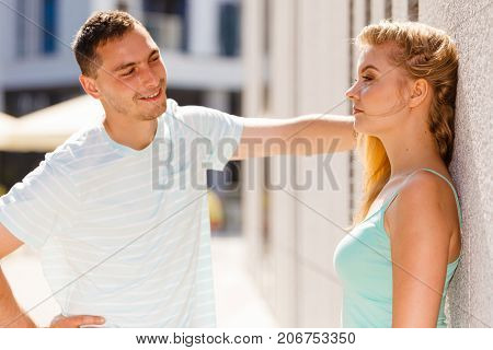 Man Flirting With Girl On City Street
