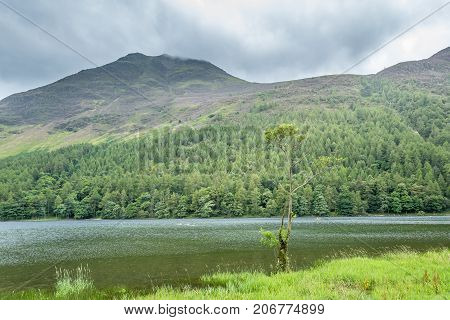 A landscape view of Buttermere one of the lakes in the Lake District Cumbria United Kingdom.