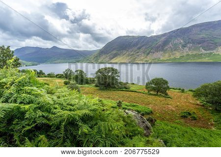 A landscape view of Crummock Water one of the lakes in the Lake District Cumbria United Kingdom.