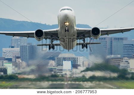 Airplane taking off from the Itami International Airport in Osaka, Japan.