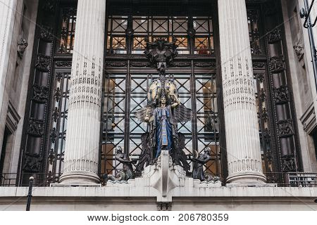 LONDON, UK - SEPTEMBER 24, 2017: Queen of Time Clock above the main entrance to Selfridges department store. The clock was installed in 1931 to mark the store's 21st birthday.