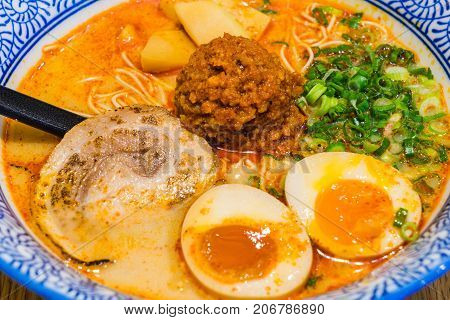 Japanese Tamago Spicy Ramen With Cha Shu Pork On Wooden Background