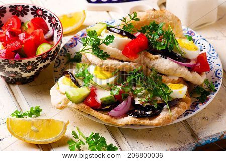pita sabich sandwich with hummus and vegetables..selective focus