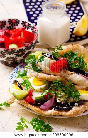 pita sabich sandwich with hummus and vegetables..selective focus