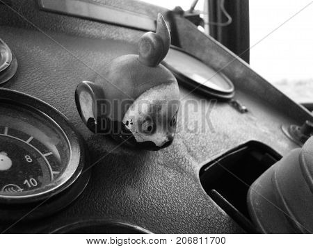 The end of childhood is the head of the Teletubbies on the dashboard of the tractor.