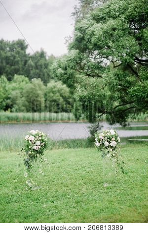 colomns with flowers for werdding ceremony in fine art style