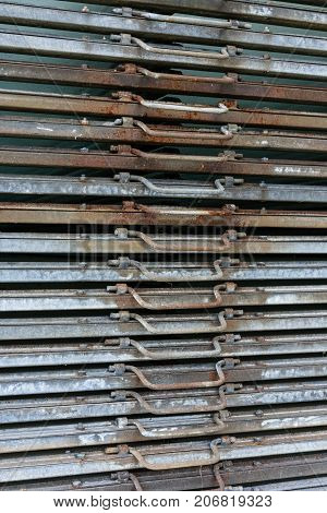 rusty iron metal plates front view with handle for industrial use and gardening