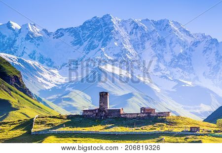 A fascinating view on Ushguli village at the foot of snow-capped Mt. Shkhara. Location place Lamaria Church Jgrag Upper Svaneti Georgia Europe. Happy lifestyle. Beautiful universe.