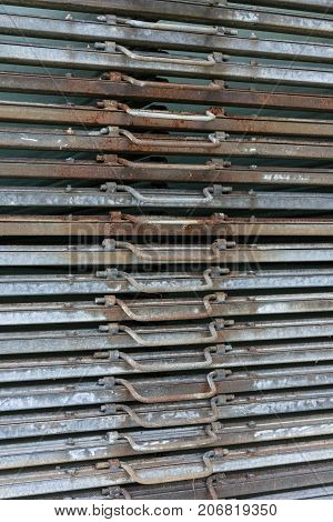 rusty iron metal plates front view with handle for industrial use and gardening