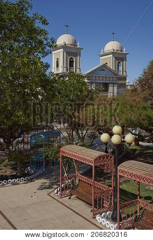 Historic church of San Andres on the edge of the Plaza in the village of Pica in the Atacama Desert, Tarapaca, Chile.