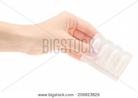 Female hand holding suppositoria medicine on white background isolation