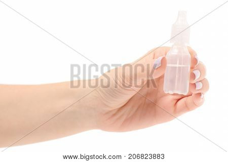 Female hand drops for a nose on a white background isolation