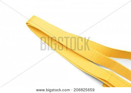 Yellow karate belt on white background
