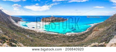 Amazing view of Balos Lagoon with magical turquoise waters, lagoons, tropical beaches of pure white sand and Gramvousa island on Crete, Greece