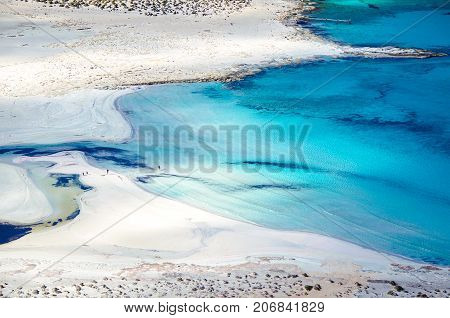 Amazing view of Balos Lagoon with magical turquoise waters, lagoons, tropical beaches of pure white sand and Gramvousa island on Crete, Greece
