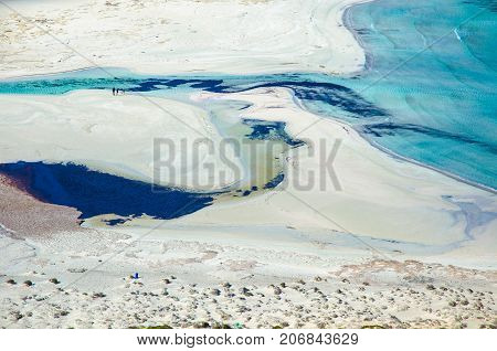 Amazing view of Balos Lagoon with magical turquoise waters, lagoons, tropical beaches of pure white sand and Gramvousa island on Crete, Greece