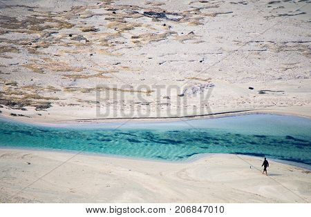 Amazing view of Balos Lagoon with magical turquoise waters, lagoons, tropical beaches of pure white sand and Gramvousa island on Crete, Greece